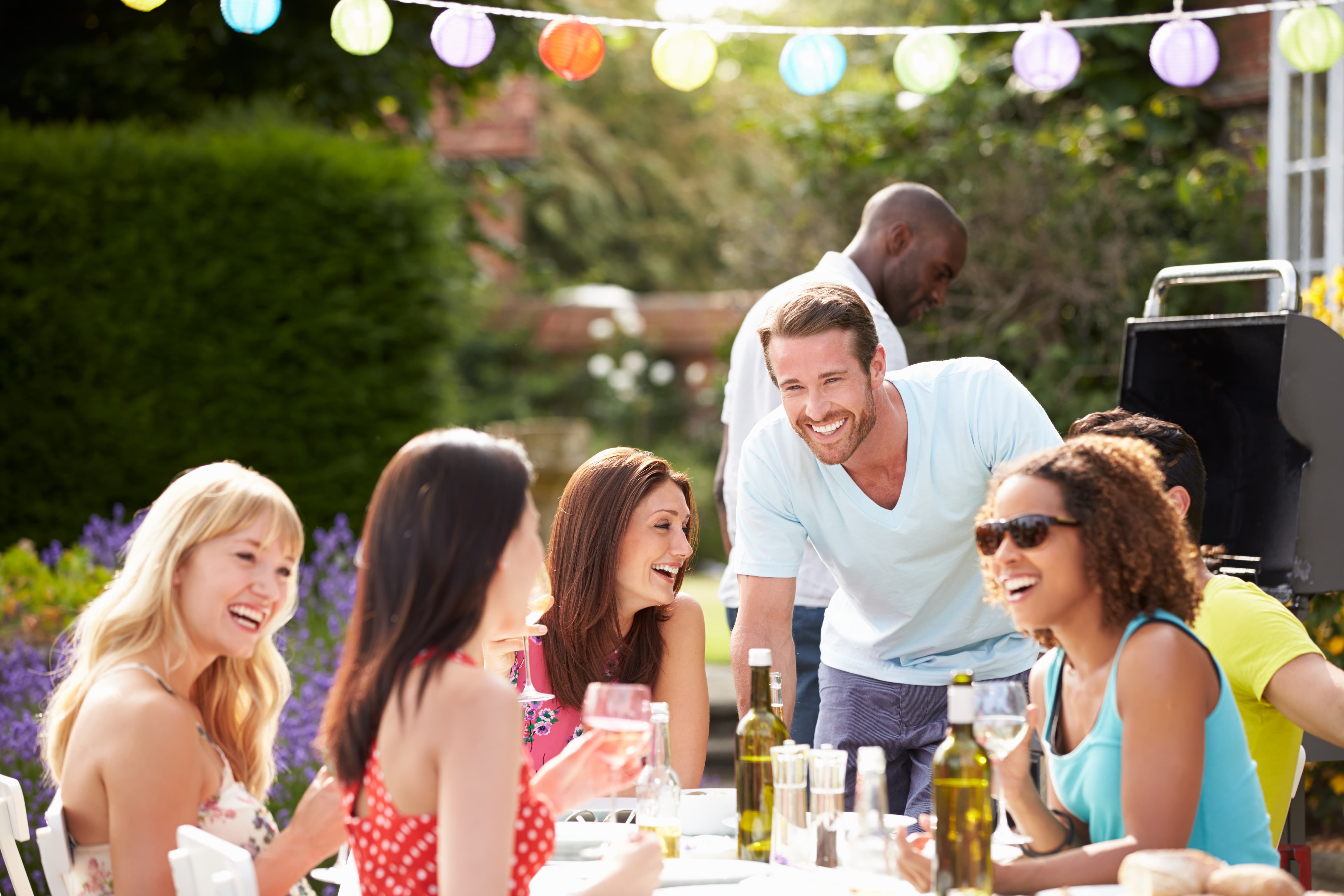 Group Of Friends Having Outdoor Barbeque At Home Versatile Vinegar