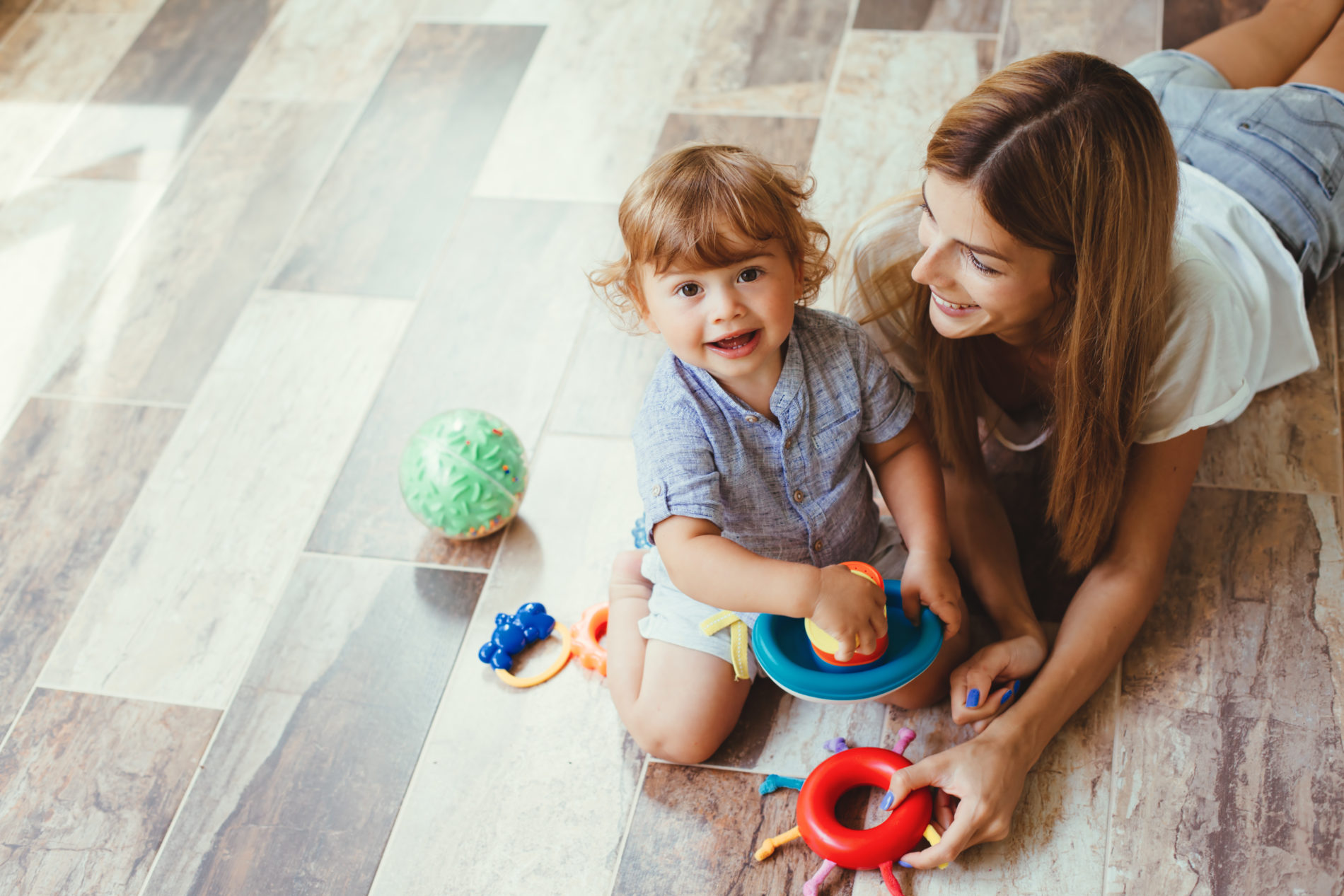 Mom playing with son on a floor – Versatile Vinegar